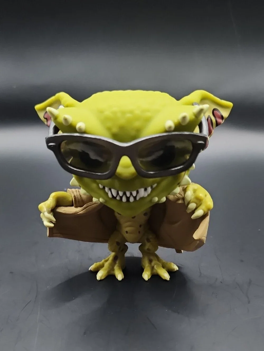 Funko Gremlin Figure with Silver Sunglasses and Tan Coat